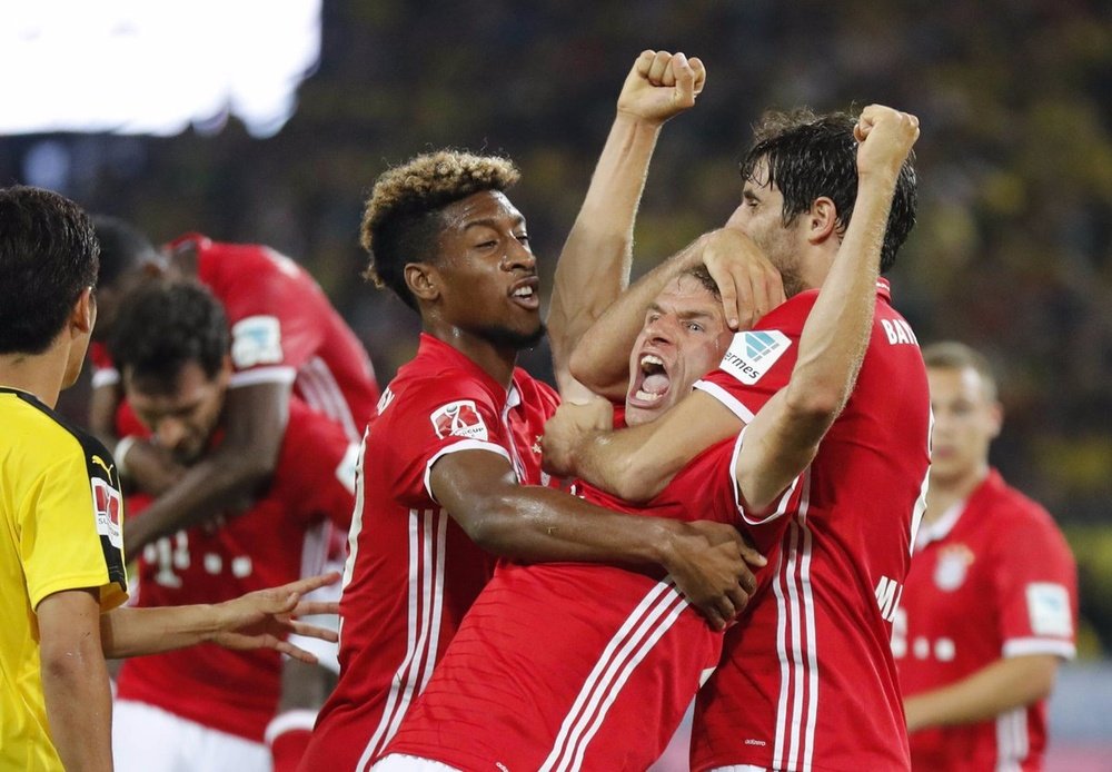 Muller celebrates scoring Bayern's second goal of the evening. FCBayern