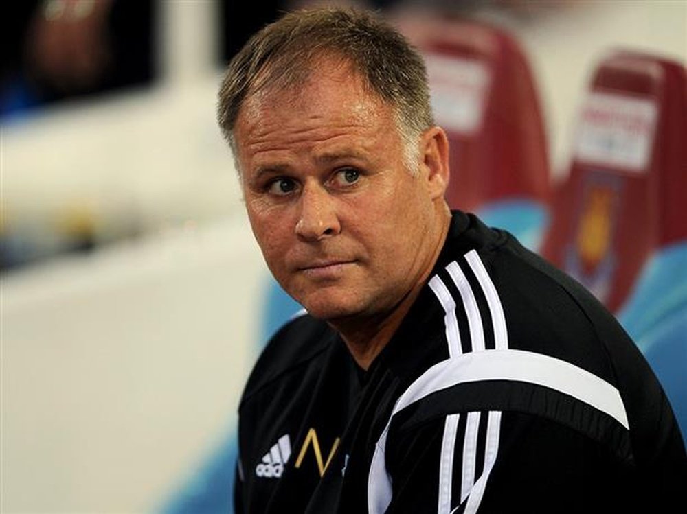 Neil McDonald sits in the dugout while he was assistant manager of West Ham. HullCityTigers