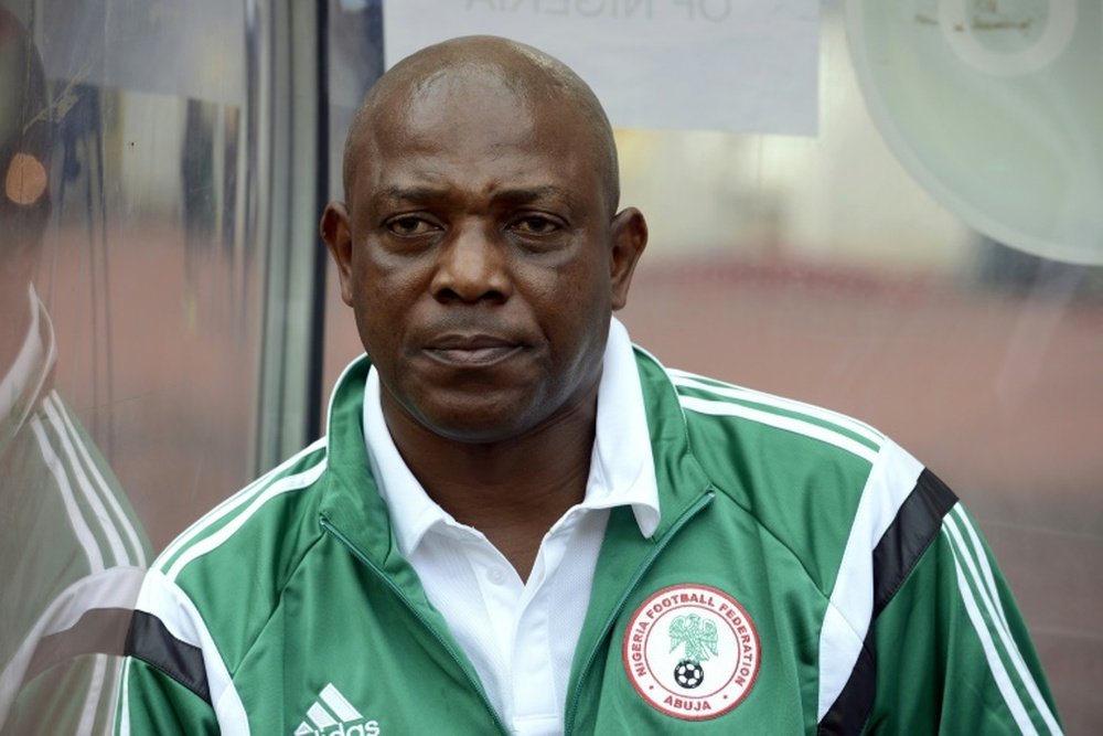 Nigeria coach Stephen Keshi watches a match between Nigeria and Sudan in Abuja on October 15, 2014