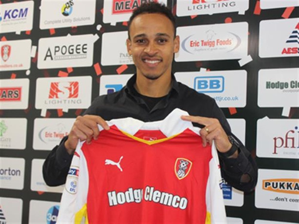 Odemwingie poses with the Rotherham United shirt. The Millers