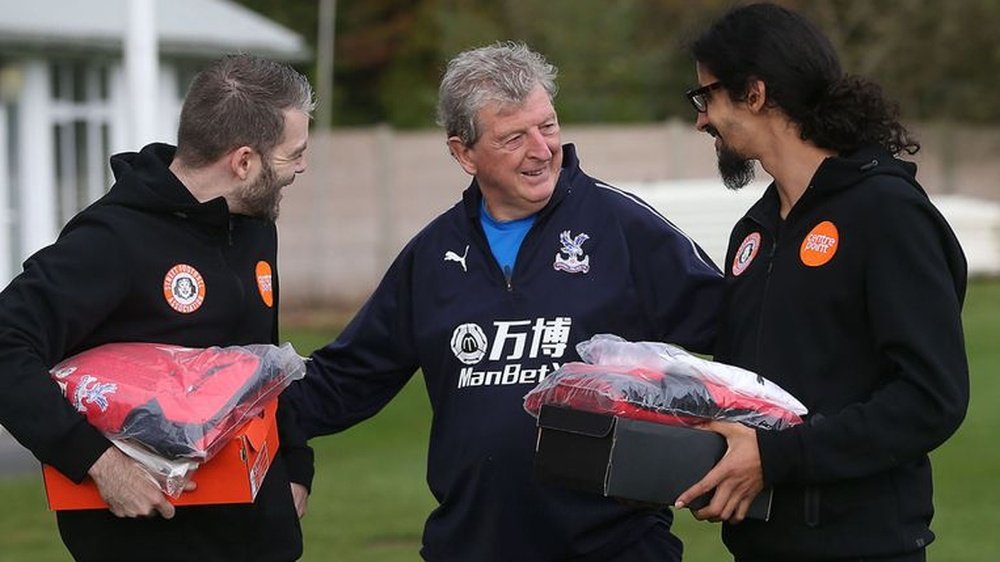 Roy Hodgson shares kind word with members of the homeless World Cup team. CPFC/TWITTER
