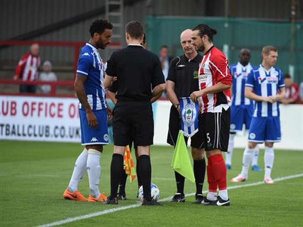 The supporter has travelled from Taiwan to watch Altrincham. WiganAthletic