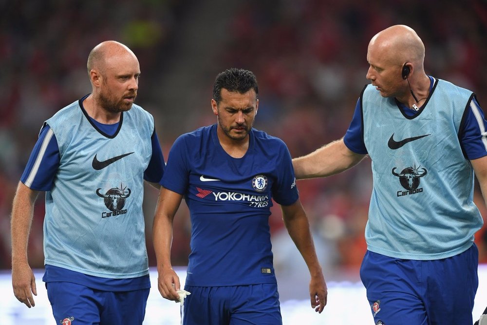 Pedro collided with Arsenal goalkeeper David Ospina. Twitter-ChelseaFC