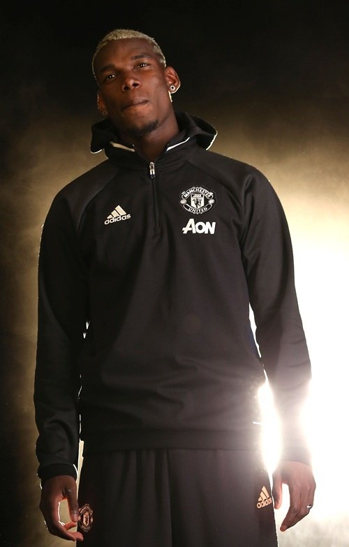 Pogba poses for pictures on his first day at United. ManUtd