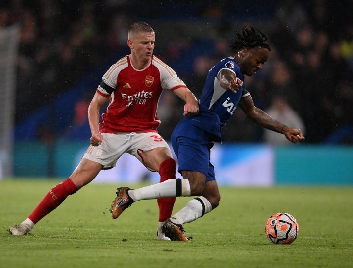 Chelsea and Arsenal share points in four-goal thriller