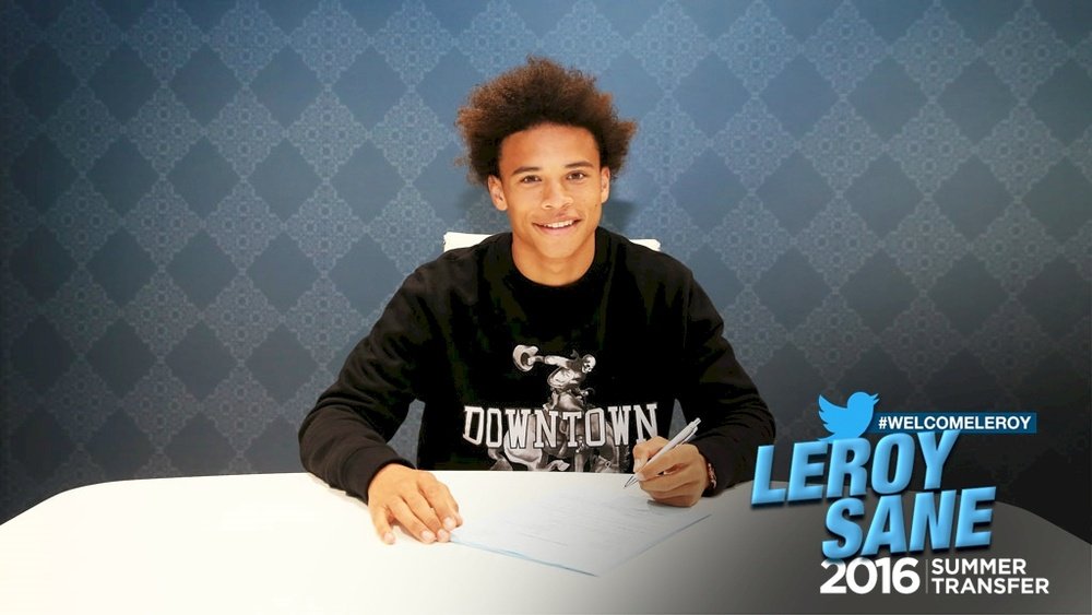 Sane signing his deal with Man City. ManCity