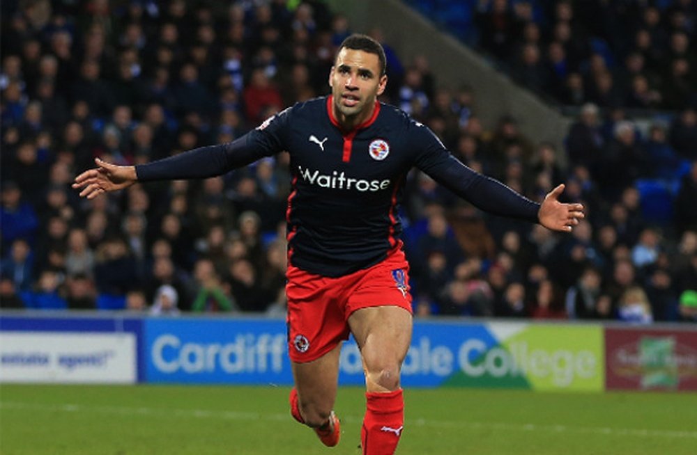 Robson-Kanu celebrates scoring for former club Reading. ReadingFC