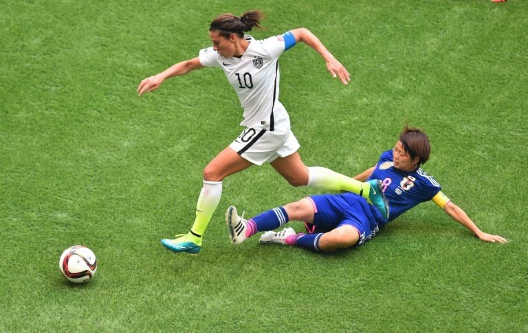 US player Carli Lloyd runs past Japan Aya Miyama during the Women World Cup final at BC Place Stadium in Vancouver.