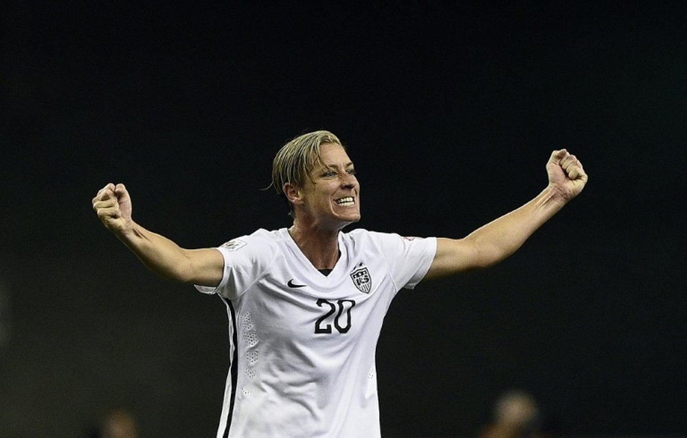 USA forward Abby Wambach celebrates after winning the semi-final football match between USA and Germany during their 2015 FIFA WWC at the Olympic Stadium in Montreal on June 30, 2015
