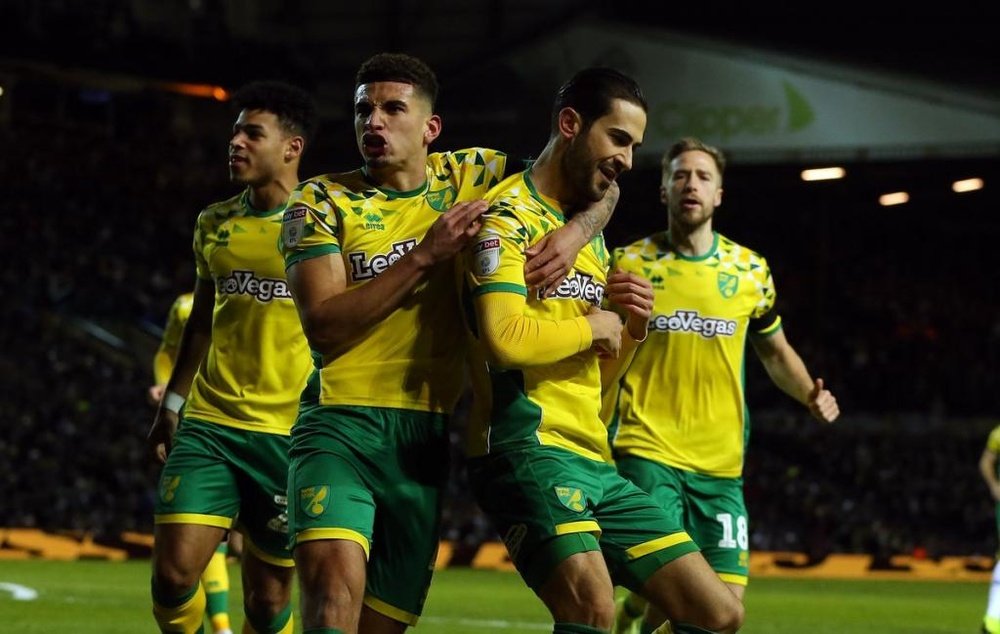 Max Aarons celebrates a goal with Norwich teammates. NorwichCityFc