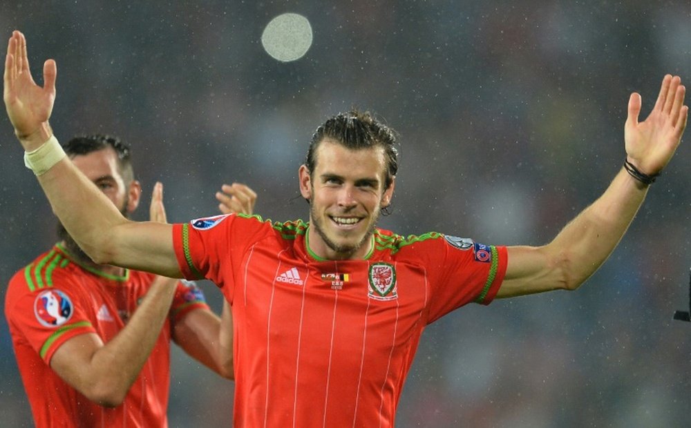 Wales midfielder Gareth Bale celebrates after the final whistle of the Euro 2016 group B qualifying match against Belgium at Cardiff City Stadium in Cardiff, south Wales, on June 12, 2015
