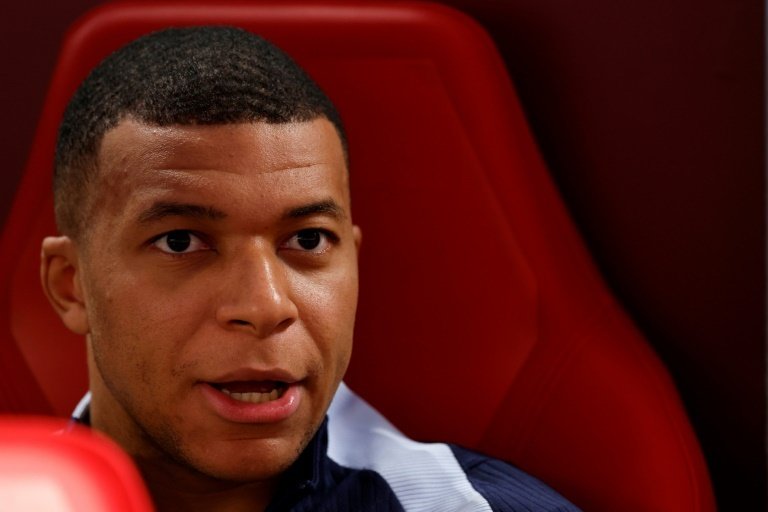 Mbappe started on the bench after breaking his nose just four days ago. AFP