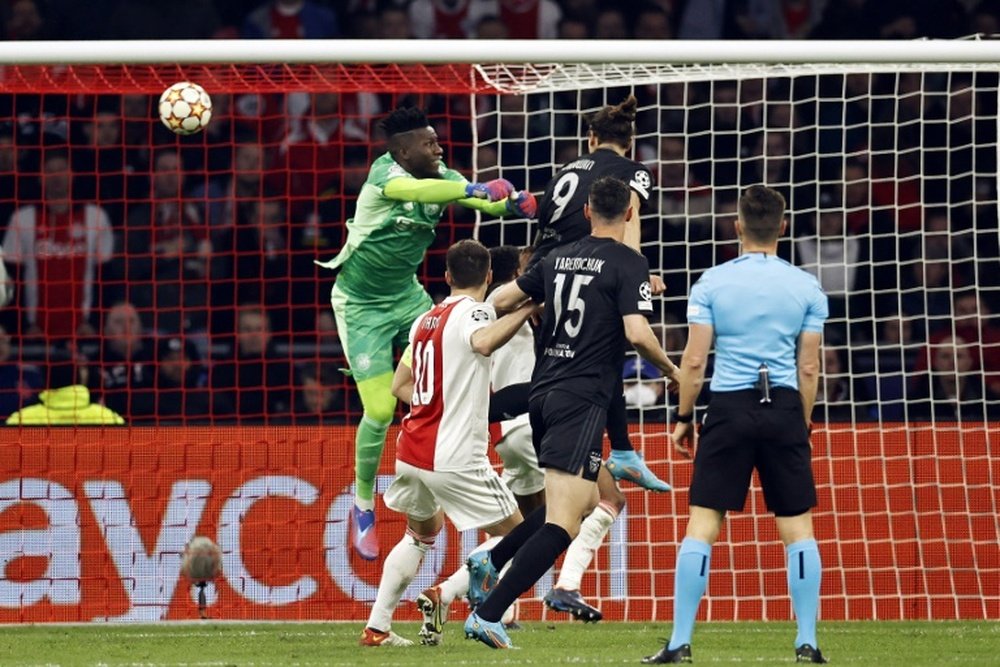 Nunez beats Onana to head in the winner as Benfica beat Ajax to reach the UCL quarter-finals. AFP