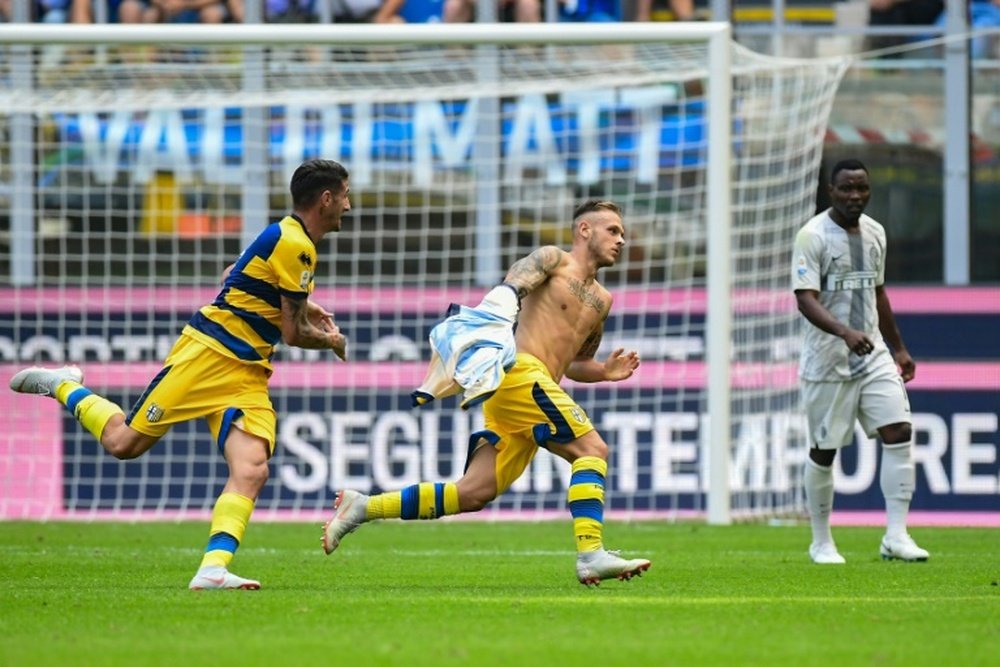 Parma businessmen increase share in club celebrates scoring against Inter Milan. AFP