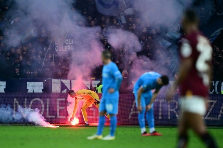 Furious supporters launched flares onto the pitch at the Stadio Olimpico Grande Torino. AFP