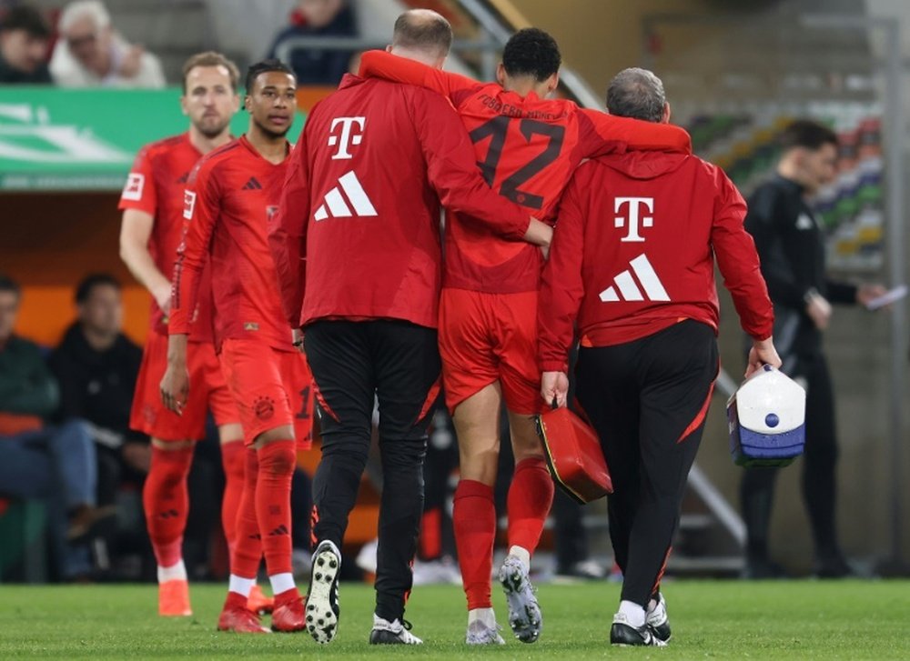 Jamal Musiala was helped from the field with a hamstring injury. AFP