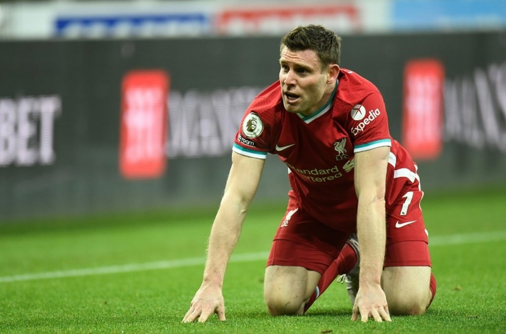 Milner says Liverpool must 'kick on' as Man Utd threaten. AFP