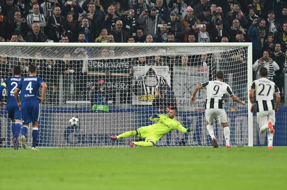 Gonzalo Higuain scores a penalty against Lyon. AFP
