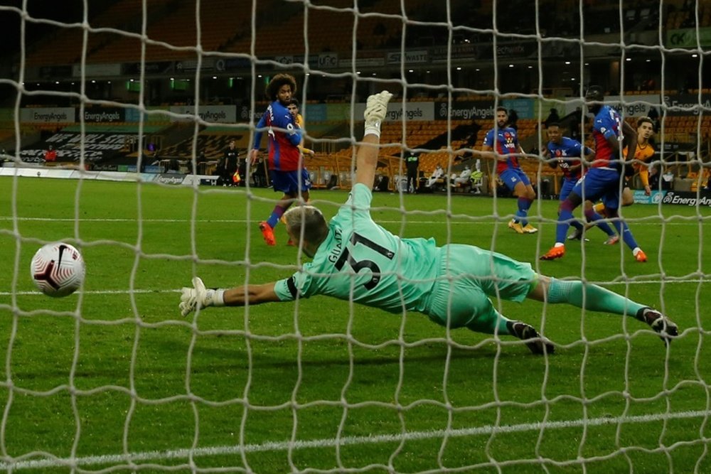 Wolves French defender Rayan Aït-Nouri (R) scores the opener. AFP