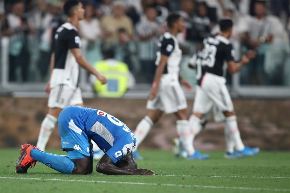 Koulibaly's own goal meant Napoli lost 4-3 after fighting back from 3-0 down v Juve. AFP