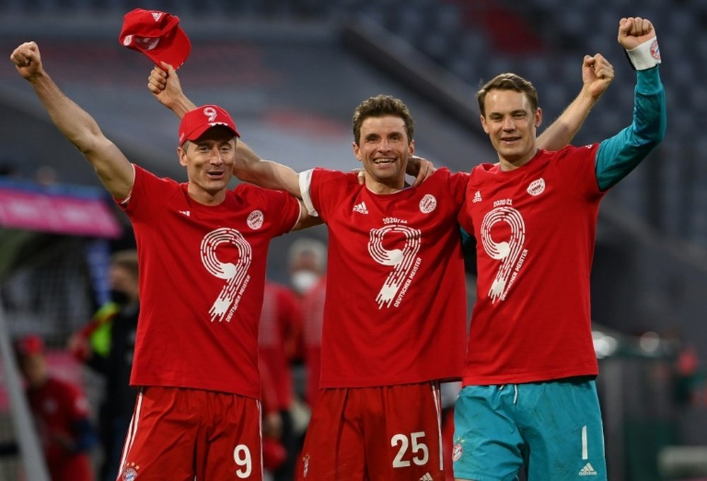 Thomas Mueller (C) has spoken about Bayern's ninth straight Bundesliga success. AFP