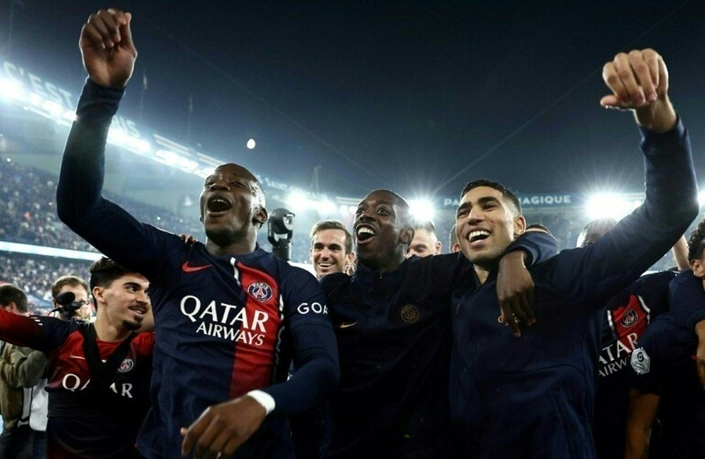 The four players filmed chanting and insulting with PSG fans have apologised for their actions. AFP