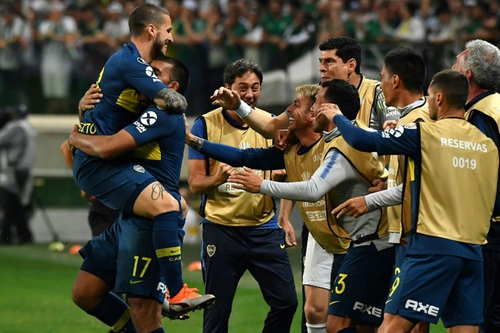 Dario Benedetto (left) celebrates scoring a goal against Palmeiras. AFP