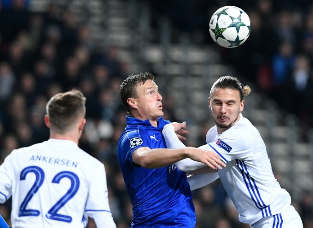 Leicester City defender Robert Huth (C) vies with FC Copenhagen defender Erik Johansson. AFP