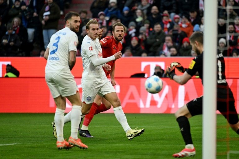 Bayern Munich stretched their lead at the top of the Bundesliga to nine points on Saturday with an extraordinary 4-3 victory over Holstein Kiel.