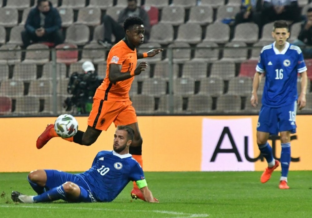 Quincy Promes (in orange) playing for the Netherlands. AFP