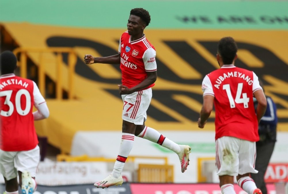 Bukayo Saka (C) scored for Arsenal in a 0-2 win at Wolves. AFP