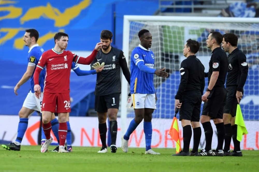 Liverpool defender Andrew Robertson complains to the officials. AFP