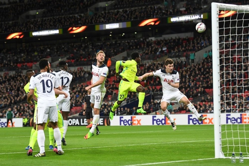Harry Kane (C) watches as his defensive header goes into his own goal
