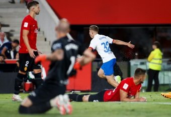 Youngster Fermin Lopez rescued Barcelona a 2-2 draw at Real Mallorca on Tuesday which extended his team's La Liga lead, even though the champions dropped two points.