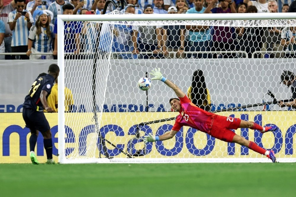 Martinez denied Ecuadors Alan Minda with a brilliant save in the penalty shoot-out. AFP