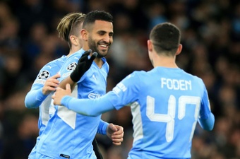 Manchester City forward Riyad Mahrez celebrates scoring against Club Brugge. AFP