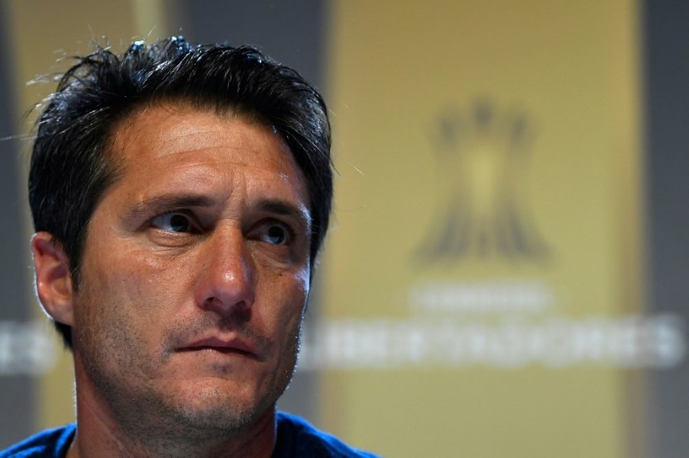 Boca Juniors coach Schelotto has condemned the historic hooliganism in Argentinian football. AFP