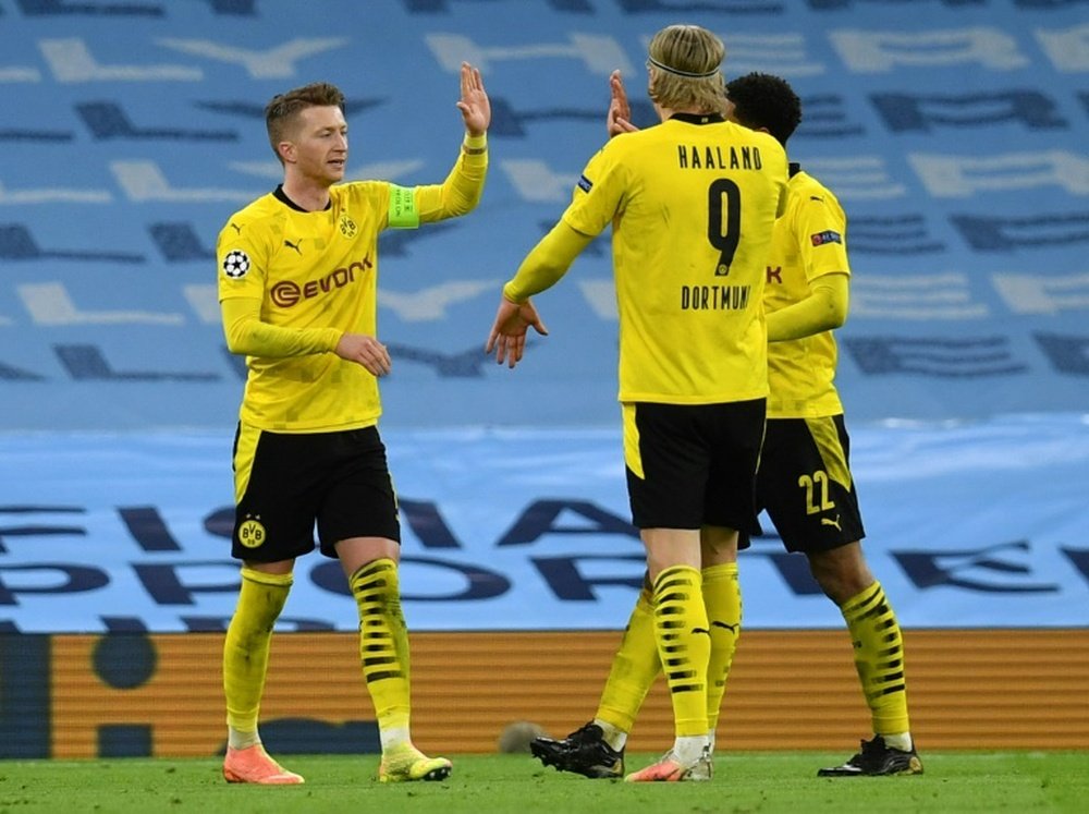 Marco Reus (L) celebrates his goal at Manchester City. AFP