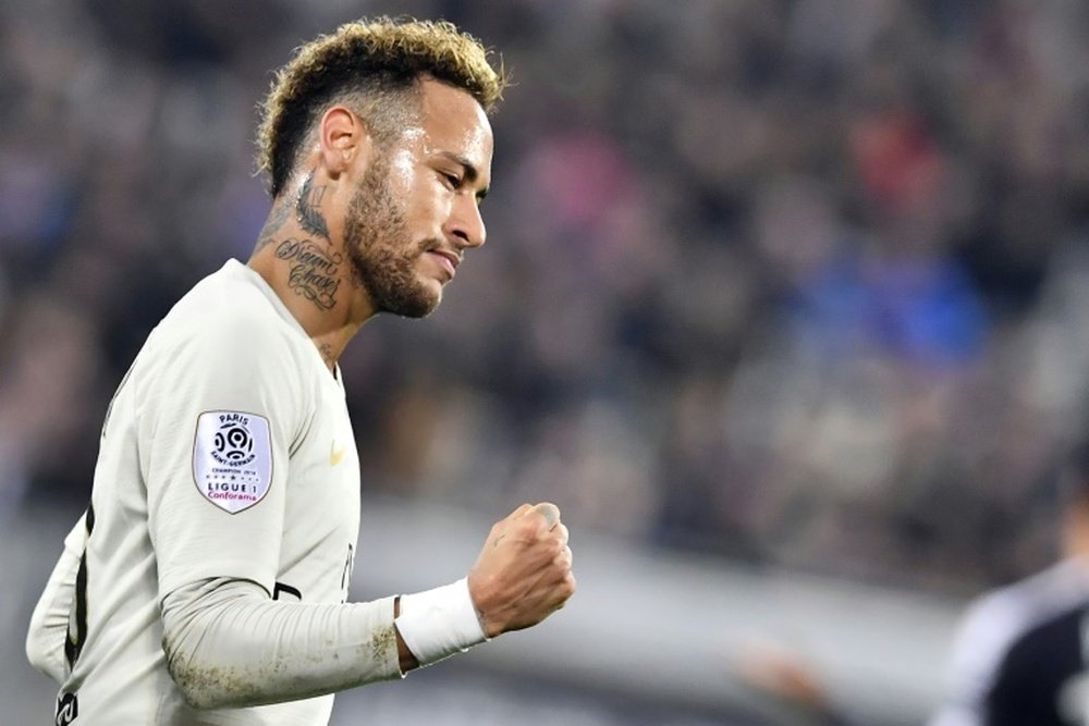 Neymar celebrates scoring his 11th league goal of the season against Bordeaux. AFP