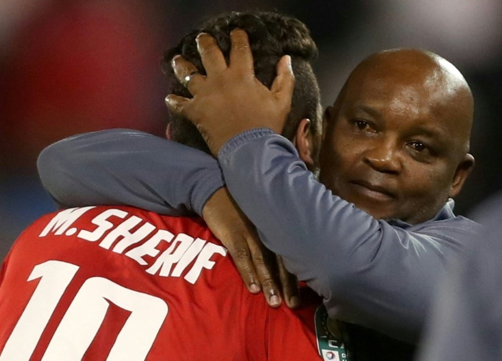 Mosimane celebrates with star forward Sherif after the Egyptian club won the CAF Super Cup. AFP
