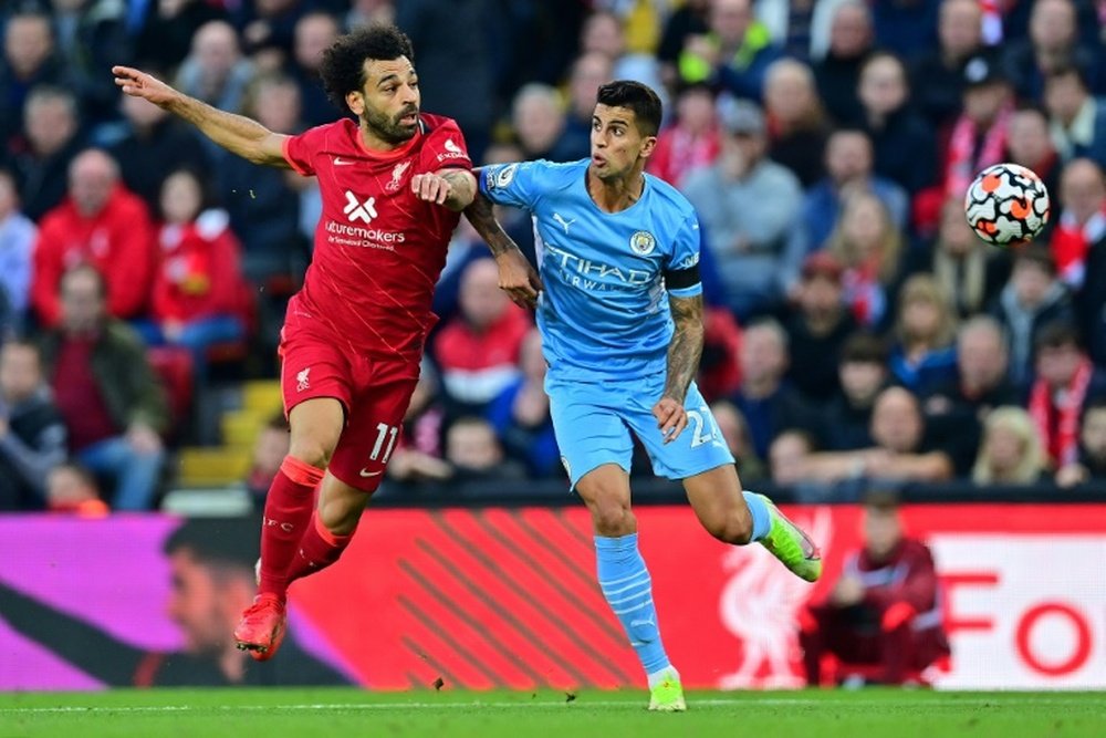 Mo Salah (L) scored as Liverpool drew 2-2 with Man City. AFP