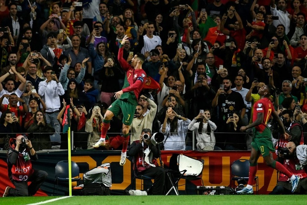Ronaldo scored twice as Portugal beat Slovakia to qualify for next years Euros. AFP