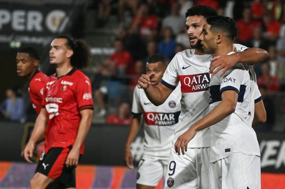 Hakimi (R) was among the scorers as Paris Saint-Germain won 3-1 in Rennes in Ligue 1. AFP