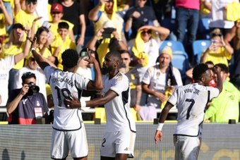 Aurelien Tchouameni's towering header earned Real Madrid a late 2-1 victory at Las Palmas and sent them top of La Liga on Saturday.