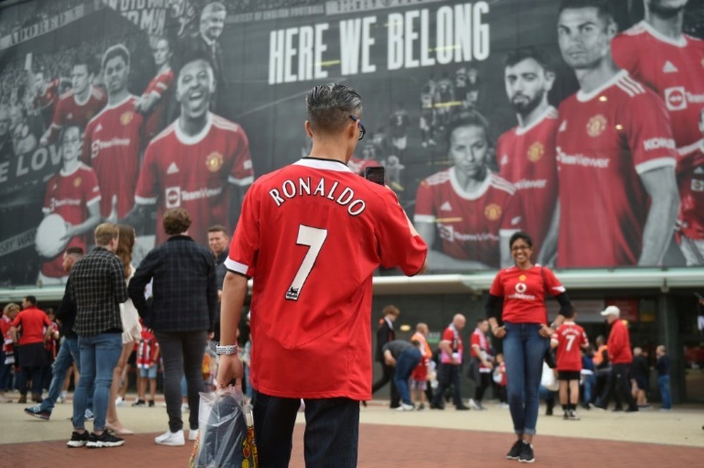 Manchester United fans outside Old Trafford. AFP