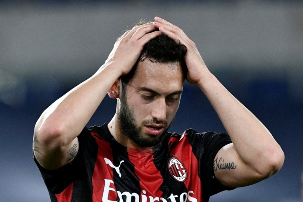 Hakan Calhanoglu has moved from the red to the blue side of Milan. AFP