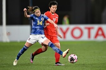 Japan punched their ticket to the Paris Olympics women's football competition with a hard-fought 2-1 win over North Korea in Wednesday's qualifying second leg in a chilly Tokyo.