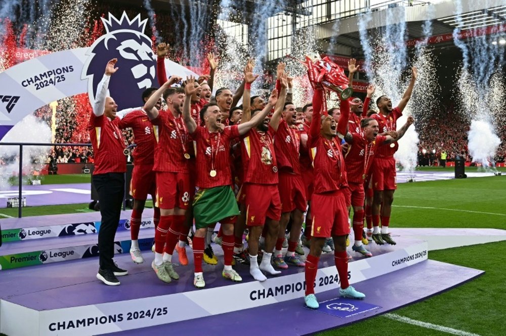 Fireworks, smoke and red ticker tape filled the air as the trophy was paraded around Anfield. AFP