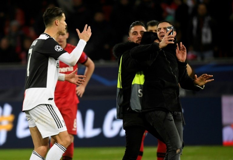 Double trouble as Ronaldo rages at selfie-hunting pitch invader