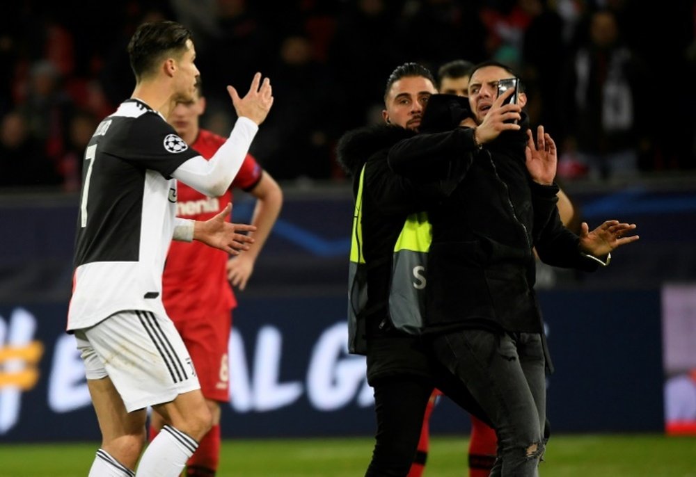Double trouble as Ronaldo rages at selfie-hunting pitch invader